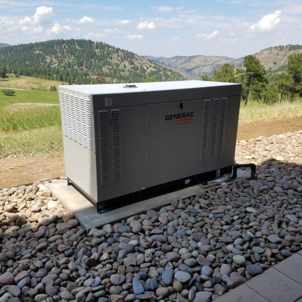 A Generac Generator installed with mountains in the background.